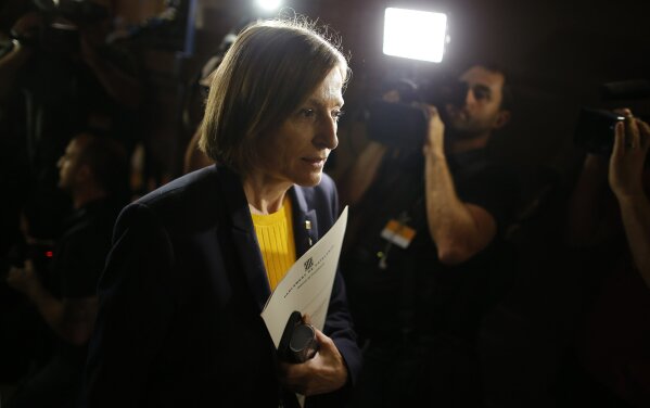 
              President of the Catalan parliament Carme Forcadell arrives to discuss their next move after the Spanish government announced plans to remove members of the region's pro-independence government, at the Catalonia Parliament, in Barcelona, Spain, Monday, Oct. 23, 2017. Rajoy has called on Spain's Senate to trigger a section of the constitution that allows the central government to temporarily govern a region if its leaders break the law.  (AP Photo/Manu Fernandez)
            
