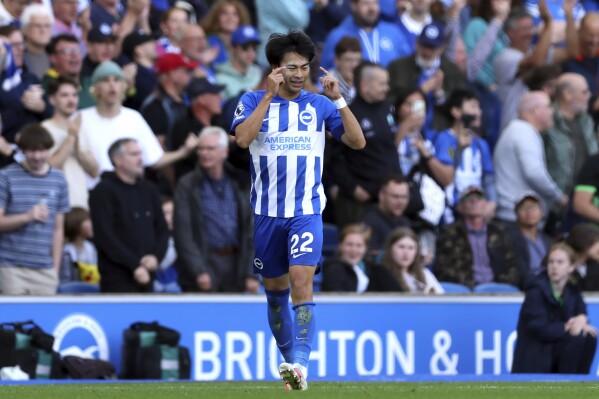 Brighton and Hove Albion's Kaoru Mitoma celebrates scoring during the English Premier League soccer match between Brighton and Hove Albion and Bournemouth at the AMEX Stadium, Brighton, England,: Sunday Sept. 24, 2023. (Steven Paston/PA via AP)