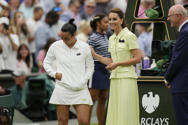 Tunisia's Ons Jabeur speaks with Britain's Kate, Princess of Wales after losing to Czech Republic's Marketa Vondrousova in the women's singles final on day thirteen of the Wimbledon tennis championships in London, Saturday, July 15, 2023. (AP Photo/Alastair Grant)