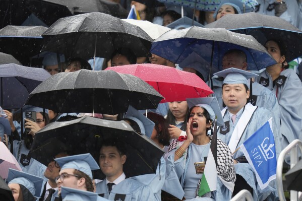 Some students react as Columbia University's acting president Claire Shipman speaks during Columbia University commencement ceremony on Columbia's main campus, in Manhattan, on Wednesday, May 21, 2025 in New York. (AP Photo/Seth Wenig, Pool)