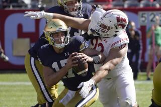 Coan limps off for No. 12 Notre Dame against Wisconsin