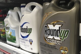FILE - In this Feb. 24, 2019, file photo, containers of Roundup are displayed on a store shelf in San Francisco. The Bayer Corporation has spent more than $10 billion to settle lawsuits that claim the popular weed killer Roundup causes cancer. But a single verdict in Philadelphia this year has topped $2 billion and thousands of cases are still to come. Bayer calls the recent verdict "excessive" and insists Roundup is safe. However, it has reformulated the consumer version to remove a pesticide called glyphosate. (AP Photo/Haven Daley, File)