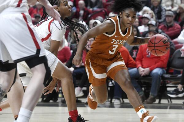 FILE - Texas guard Rori Harmon (3) dribbles the ball against Texas Tech during an NCAA college basketball game, Wednesday, Jan. 18, 2023, in Lubbock, Texas. The Texas Longhorns' quick fall from preseason No. 3 all the way to unranked was one of the biggest disappearing acts of the women's college basketball season. They're still unranked, but it's easy to find them now. Just look at the top of the Big 12 standings. (Annie Rice/Lubbock Avalanche-Journal via AP, File)