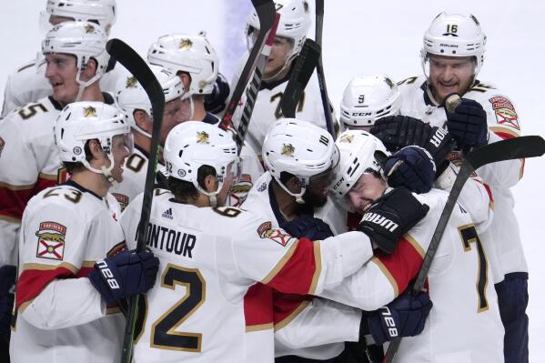 Florida Panthers center Frank Vatrano (77) celebrates with teammates after his overtime goal against San Jose Sharks in an NHL hockey game in San Jose, Calif., Tuesday, March 15, 2022. (AP Photo/Tony Avelar)