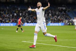 Real Madrid's Karim Benzema celebrates after scoring his team's fifth goal during a Spanish La Liga soccer match between Real Madrid and Mallorca at the Bernabeu stadium in Madrid, Spain, Wednesday, Sept. 22, 2021. (AP Photo/Manu Fernandez)