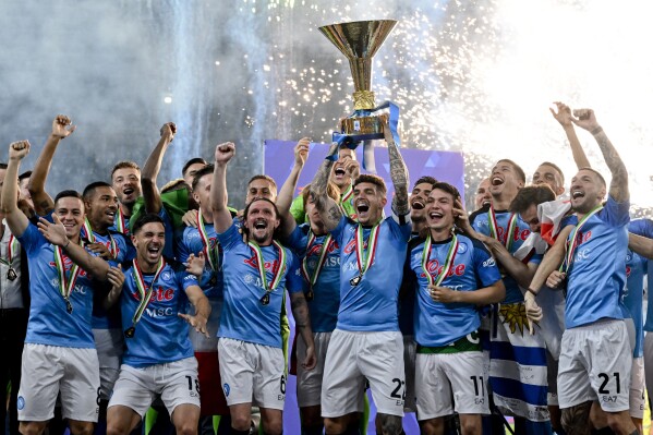 FILE - Napoli's players celebrate after winning the Serie A soccer title trophy at the Diego Maradona Stadium, in Naples, Sunday, June 4, 2023. (Ciro Fusco/ANSA, Pool Photo via AP, File)
