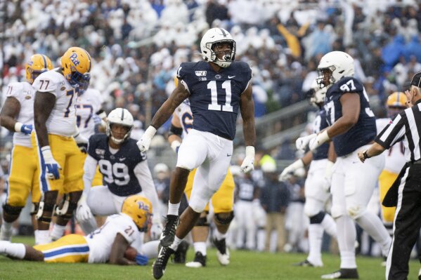 Penn State linebacker Micah Parsons (11) celebrates after stopping Pittsburgh running back A.J. Davis (21) in the second quarter of an NCAA college football game in State College, Pa., on Saturday, Sept. 14, 2019. Penn State defeated Pittsburgh 17-10. (AP Photo/Barry Reeger)