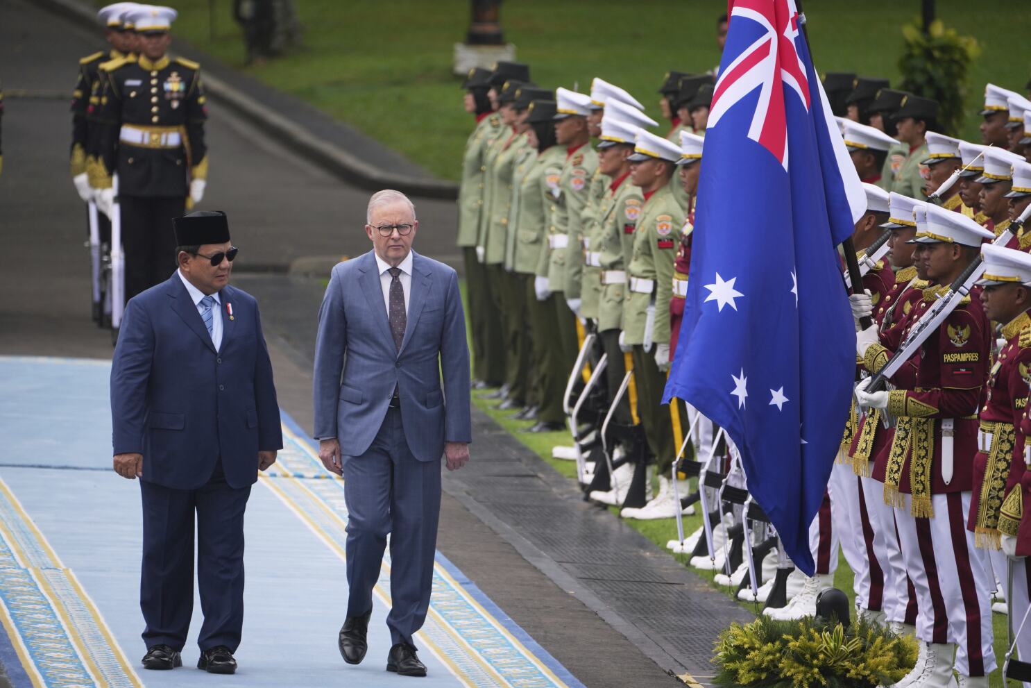 Australian leader visits Indonesia seeking deeper economic and defense ties