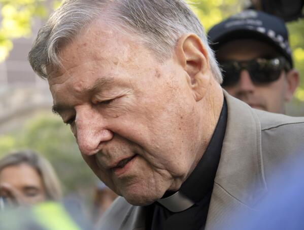 FILE - In this Feb. 27, 2019, file photo, Cardinal George Pell arrives at the County Court in Melbourne, Australia. Cardinal George Pell, the former Vatican finance minister who was convicted and then absolved of sexual abuse in his native Australia, is set to publish his prison diary musing on life in solitary confinement, the Psalms, the church, politics and sports. Catholic publisher Ignatius Press told The Associated Press on Saturday the first installment of the 1,000-page diary would likely be published in Spring 2021. (AP Photo/Andy Brownbill, File)