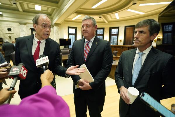 Lt. Gov. Delbert Hosemann, left, speaks to reporters alongside Senate Appropriations Committee member Dennis DeBar Jr., R-Leakesville, center, and Senate Appropriations Committee Chairman Briggs Hopson, R-Vicksburg, about proposed legislation to fully fund the Mississippi Adequate Education Program (MAEP) and inject an additional $181.1 million into school budgets, following a meeting of the committee Monday, March 6, 2023, at the Mississippi Capitol in Jackson. (AP Photo/Rogelio V. Solis)