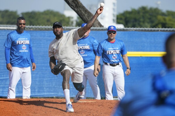 Pitcher Aroldis Chapman throws during practice with the Cuban Professional Baseball Federation (FEPCUBE), Tuesday, Jan. 16, 2024, in Miami. The team is a group of about 30 or so players, most of whom were born in Cuba and defected from their home island. They’re not affiliated with the Baseball Federation of Cuba (FCB), the sport’s governing body in Cuba, but were put together to field a team that represents the patriotic ideals of their people. (AP Photo/Lynne Sladky)