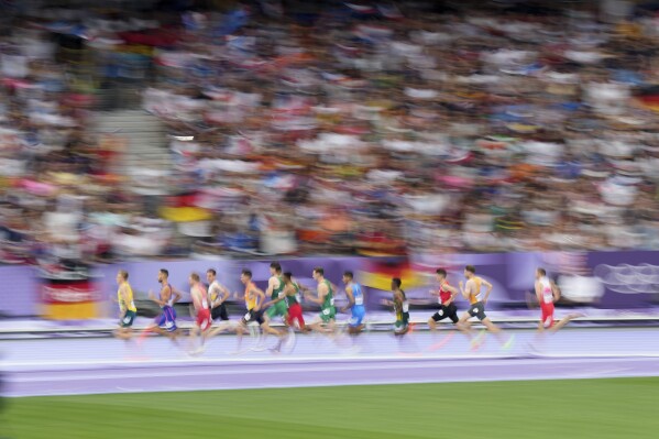 Athletes compete in a men's 1500 meters repechage round heat at the 2024 Summer Olympics, Saturday, Aug. 3, 2024, in Saint-Denis, France. (AP Photo/Martin Meissner)