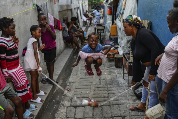 A girl plays a jump rope game at a school housing residents displaced by gang violence, in Port-au-Prince, Haiti, May 15, 2024. (Ǻ Photo/Ramon Espinosa)