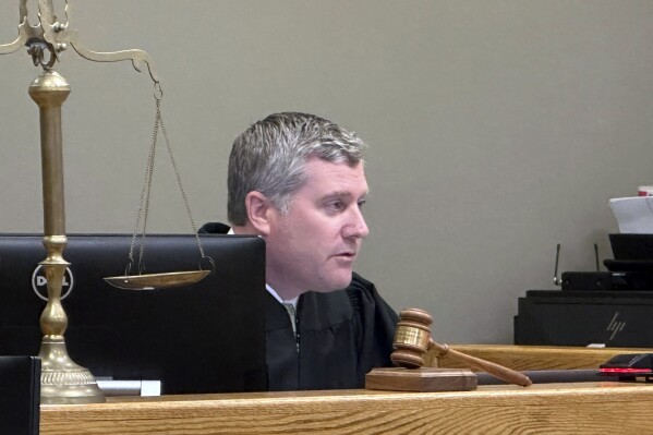 Judge Matthew McGivney presides during the sentencing of Barry Cadden Friday, May 10, 2024, in Howell, Mich. Cadden, a former executive of a specialty pharmacy, was sentenced to at least 10 years in prison Friday for the deaths of 11 people who were injected with tainted pain medication, part of a meningitis outbreak that affected hundreds across the U.S. in 2012. (AP Photo/Ed White)