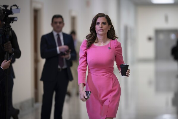 FILE - Rep. Nancy Mace, walks to join other members of the House Oversight Committee, Dec. 13, 2023, at the Capitol in Washington. Three Republican incumbent U.S. House members in South Carolina are facing primary challengers in 2024, including Mace, who is seeking a third term with the backing of Donald Trump. (AP Photo/J. Scott Applewhite, File)