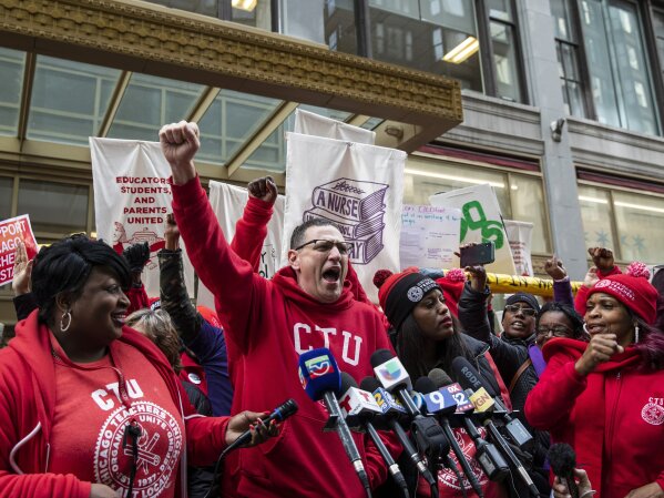 Chicago Teachers Union President Jesse Sharkey speaks during a rally outside Chicago Public Schools headquarters in the Loop, before marching through downtown with thousands of striking union members and their supporters, Thursday, Oct. 17, 2019, in Chicago. Striking teachers went on strike after their union and city officials failed to reach a contract deal in the nation's third-largest school district. (Ashlee Rezin Garcia/Chicago Sun-Times via AP)