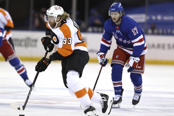 Philadelphia Flyers' Jakub Voracek (93) takes the puck as New York Rangers' Kevin Rooney (17) defends in the first period of an NHL hockey game Thursday, April 22, 2021, in New York. (Elsa/Pool Photo via AP)