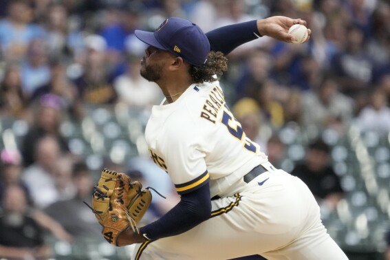 Milwaukee Brewers starting pitcher Freddy Peralta throws during the first inning of a baseball game against the Colorado Rockies Monday, Aug. 7, 2023, in Milwaukee. (AP Photo/Morry Gash)