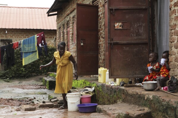 Barbara Nabulo cleans clothes at her home in Busamaga-Mutukula village in Mbale, Uganda, Thursday, April 25, 2024. There can be lifelong challenges for people with sickle cell disease in rural Uganda, where it remains poorly understood. (AP Photo/Hajarah Nalwadda)
