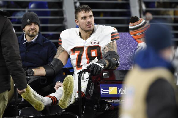 FILE - Cleveland Browns offensive tackle Jack Conklin leaves the field on a cart during the first half of an NFL football game against the Baltimore Ravens, Sunday, Nov. 28, 2021, in Baltimore. The Browns placed Conklin on the active/PUP list on Tuesday, July 26, 2022, at the start of their training camp. (AP Photo/Gail Burton, File)