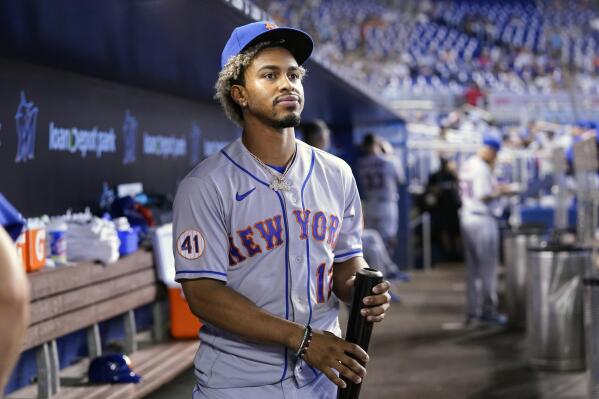 FILE - In this Thursday, Aug. 5, 2021, file photo, New York Mets' Francisco Lindor looks from the dugout before a baseball game against the Miami Marlins, in Miami. Lindor says first-year New York Mets owner Steve Cohen was right to criticize his hitting in a recent tweet. Cohen tweeted Wednesday, Aug. 18 about his struggling ballclub that “it’s hard to understand how professional hitters can be this unproductive.” (AP Photo/Lynne Sladky, File)