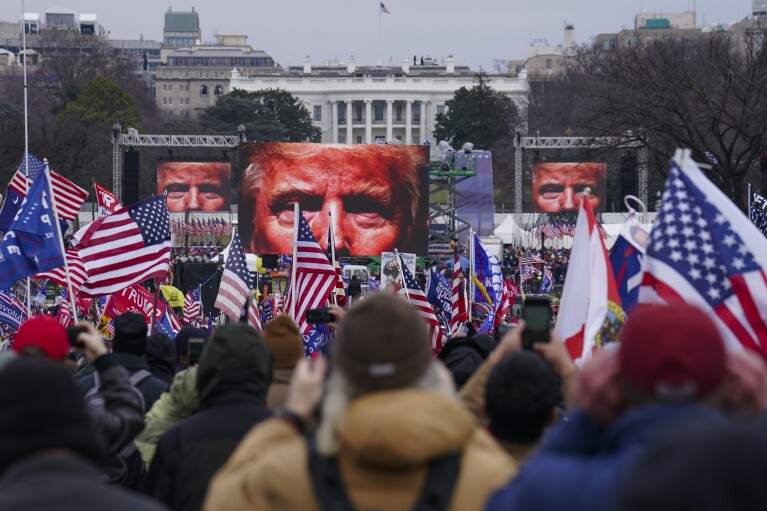 FILE - Trump supporters participate in a rally in Washington, Jan. 6, 2021, that some blame for fueling the attack on the U.S. Capitol. On Thursday, Feb. 8, the nation's highest court is scheduled to hear arguments in a case involving Section 3 of the 14th Amendment, which prohibits those who “engaged in insurrection or rebellion” from holding office. The case arises from a decision in Colorado, where that state's Supreme Court ruled that Trump violated Section 3 of the 14th Amendment and should be banned from ballot. (AP Photo/John Minchillo, File)