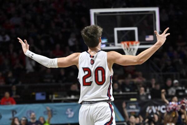 Saint Mary's guard Aidan Mahaney (20) reacts after a 3-point basket during the first half of an NCAA college basketball game against BYU in the semifinals of the West Coast Conference men's tournament Monday, March 6, 2023, in Las Vegas. (AP Photo/David Becker)
