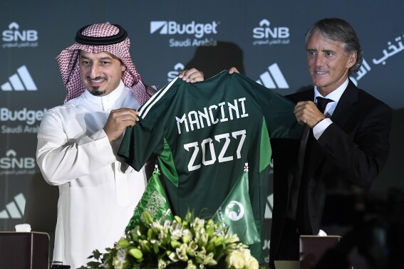 Roberto Mancini and Yasser Al Misehal, the Saudi Arabian Football Federation president, attend a press conference in Riyadh, Saudi Arabia, on Monday, Aug. 28, 2023. Mancini was appointed coach of the Saudi Arabia national team on Sunday, just two weeks after the European Championship-winning manager surprisingly left his job in charge of Italy. (AP Photo)