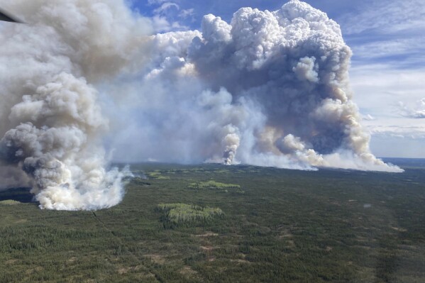 This photo provided by the BC Wildfire Service shows a view of the Parker Lake wildfire near Fort Nelson, B.C. on Monday, May 13, 2024. (BC Wildfire Service/The Canadian Press via AP)