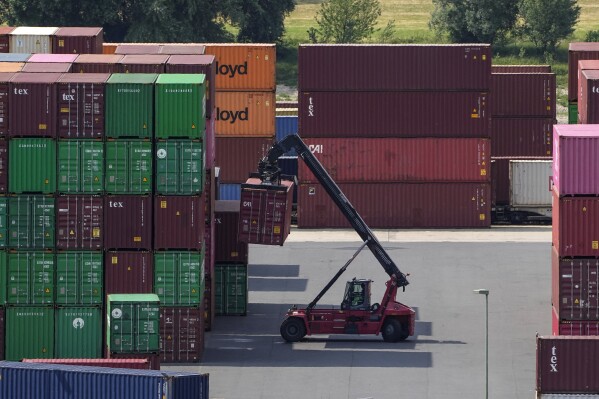 FILE -Containers are stored at the Rhein-Ruhr Terminal in Duisburg, Germany, Monday, June 26, 2023. Germany's economy is likely to shrink again slightly in the current fourth quarter, the country's central bank said Monday, while a survey showed business confidence in Europe's biggest economy retreating unexpectedly. (AP Photo/Martin Meissner, File)