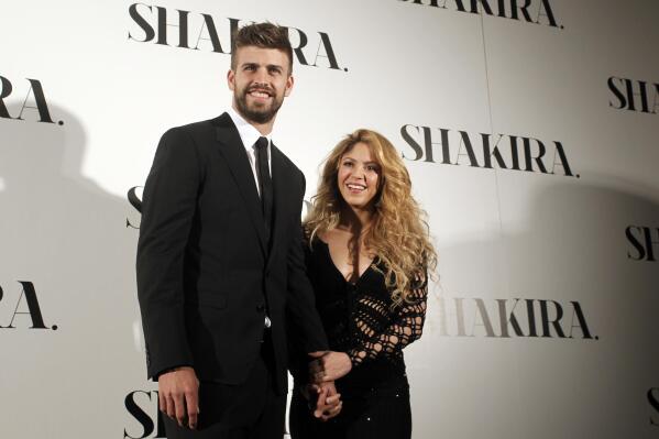 FILE - Colombian singer Shakira, right, and FC Barcelona's soccer player Gerard Pique pose to the media during the presentation of her new album "Shakira" in Barcelona, Spain, on March 20, 2014. Colombian pop star Shakira and her partner, Spanish soccer star Gerard Piqué, are separating. In a statement released on Saturday by Shakira's PR firm, the pair said: “We regret to confirm that we are separating. For the well-being of our children, who are our highest priority, we ask that you respect our privacy. (AP Photo/Manu Fernandez, File)