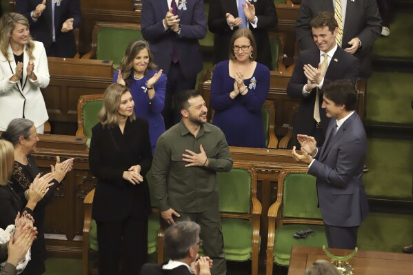 Ukrainian President Volodymyr Zelenskyy receives a standing ovation from Canadian Prime Minister Justin Trudeau and parliamentarians after delivering a speech in the House of Commons on Parliament Hill in Ottawa, Ontario, on Friday, Sept. 22, 2023. (Patrick Doyle/The Canadian Press via AP)