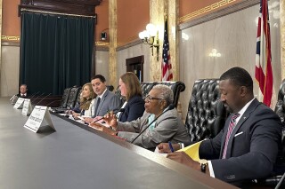 FILE - Members of the Ohio Ballot Board convene at the Ohio Statehouse in Columbus, Ohio, Aug. 16, 2024, to consider language for a fall redistricting amendment. (AP Photo/Julie Carr Smyth, File)