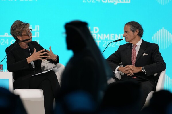 Rafael Mariano Grossi, right, the director-general of the International Atomic Energy Agency, talks to CNN's anchor Becky Anderson during the World Governments Summit in Dubai, United Arab Emirates, Tuesday, Feb. 13, 2024. The head of the United Nations' nuclear watchdog warned Tuesday that Iran is "not entirely transparent" regarding its atomic program, particularly after an official who once led Tehran's program announced the Islamic Republic has all the pieces for a weapon "in our hands." (AP Photo/Kamran Jebreili)