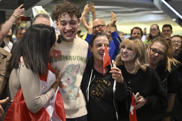 Swiss Singer Nemo, winner of the 68th edition of the Eurovision Song Contest, ESC, arrives at Zurich airport in Kloten, Switzerland, Sunday, May 12, 2024. (Walter Bieri /Keystone via AP)