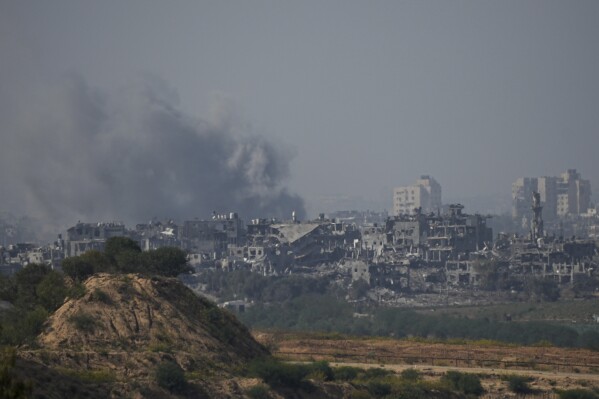 Smoke rises following an Israeli airstrike in the Gaza Strip, as seen from southern Israel, Friday, Nov. 3, 2023. (AP Photo/Ohad Zwigenberg)