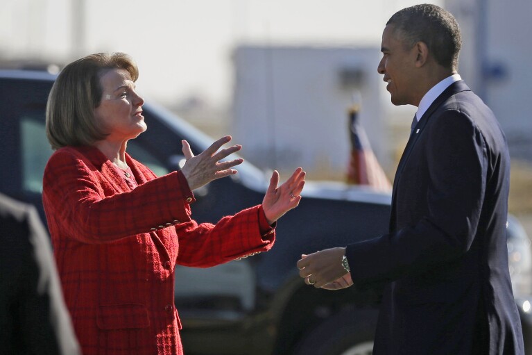 FILE - President Barack Obama and U.S. Sen. Dianne Feinstein, D-Calif., greet each other on the tarmac upon his arrival on Air Force One at San Francisco International Airport, Nov. 25, 2013. (AP Photo/Pablo Martinez Monsivais, File)