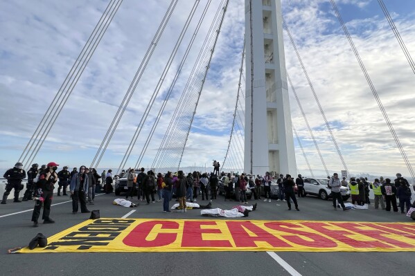 Demonstrators shut down the San Francisco Oakland Bay Bridge in conjunction with the APEC Summit taking place Thursday, Nov. 16, 2023, in San Francisco. (AP Photo/Noah Berger)