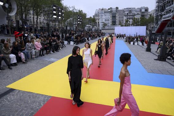 Models wear creations for the Stella McCartney ready-to-wear Spring/Summer 2023 fashion collection presented Monday, Oct. 3, 2022 in Paris. (Photo by Vianney Le Caer/Invision/AP)