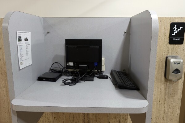 This photo shows a computer terminal normally used by the public to access Kansas court records shut down, Wednesday, Oct. 25, 2023, at the Shawnee County Courthouse in Topeka, Kan.. Most of the state's courts have been offline since Oct. 12, 2023, in what officials are calling a 