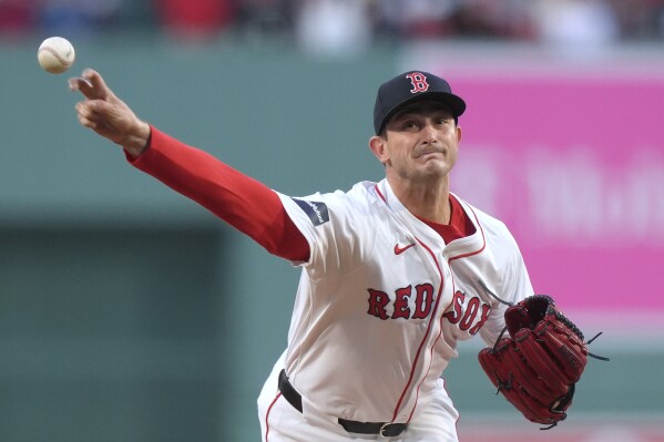 Boston Red Sox's Garrett Whitlock delivers a pitch to a Boston Red Sox batter during the first inning of a baseball game Tuesday, April 16, 2024, in Boston. (AP Photo/Steven Senne)
