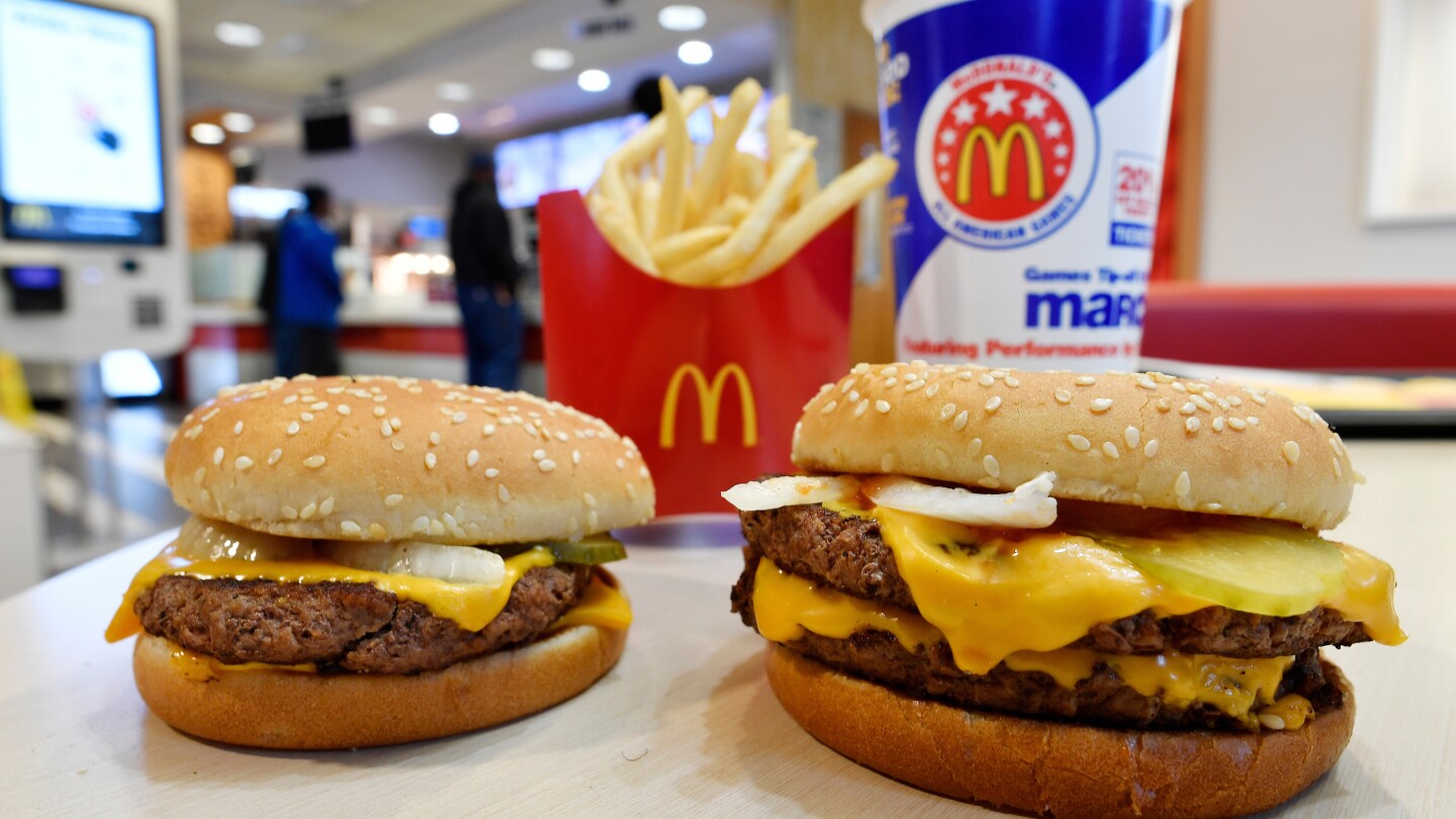 FILE- A McDonald’s Quarter Pounder, left, and Double Quarter Pound burger is shown with fresh beef in Atlanta, March 6, 2018. A top European Union c