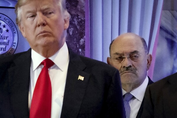 FILE - Allen Weisselberg, right, stands behind then President-elect Donald Trump during a news conference in the lobby of Trump Tower in New York, Jan. 11, 2017. A New York judge ruled Friday, Feb. 16, 2024, against Donald Trump, imposing a $364 million penalty over what the judge ruled was a yearslong scheme to dupe banks and others with financial statements that inflated the former president's wealth. (AP Photo/Evan Vucci, File)