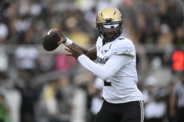 Colorado quarterback Shedeur Sanders (2) throws a pass against Central Florida during the first half of an NCAA college football game, Saturday, Sept. 28, 2024, in Orlando, Fla. (AP Photo/Phelan M. Ebenhack, File)