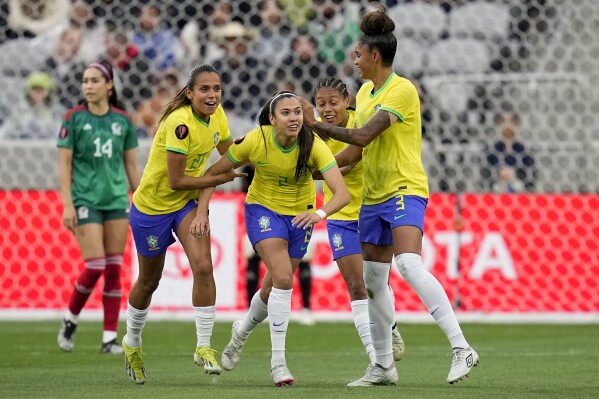 Brazil's Antonia, center, celebrates with teammates after scoring a goal against Mexico during the first half of a CONCACAF Gold Cup women's soccer tournament semifinal match, Wednesday, March 6, 2024, in San Diego. (AP Photo/Gregory Bull)