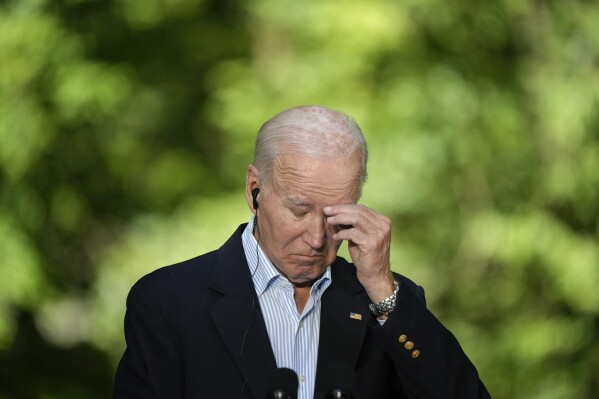 President Joe Biden reacts during a joint news conference with Japan's Prime Minister Fumio Kishida and South Korea's President Yoon Suk Yeol on Friday, Aug. 18, 2023, at Camp David, the presidential retreat, near Thurmont, Md. (AP Photo/Andrew Harnik)