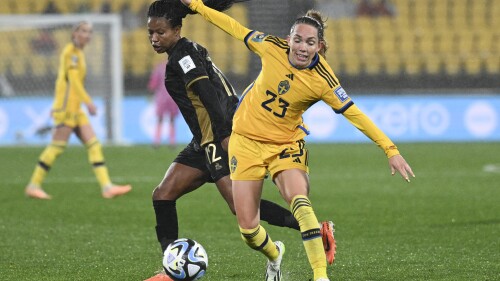 Sweden's Elin Rubensson, right, and South Africa's Jermaine Seoposenwe compete for the ball during the Women's World Cup Group G soccer match between Sweden and South Africa in Wellington, New Zealand, Sunday, July 23, 2023. (AP Photo/Andrew Cornaga)