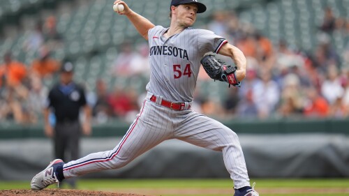 Minnesota Twins starting pitcher Sonny Gray throws a pitch to the Baltimore Orioles in the second inning of a baseball game, Sunday, July 2, 2023, in Baltimore. (AP Photo/Julio Cortez)