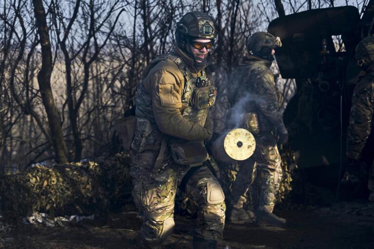FILE - Ukrainian soldiers prepare to fire on the front line near Bakhmut, in Ukraine’s Donetsk region, on Feb. 8, 2023. While Russia stubbornly presses its goals in the war, Ukraine and its Western allies want to prevent Moscow from ending the conflict with any territorial gains. (AP Photo/Libkos, File)
