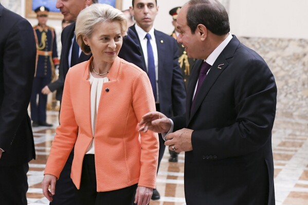 In this photo provided by Egypt's presidency media office, Egyptian President Abdel-Fattah el-Sissi, right, talks to European Commission president Ursula Von der Leyen, at the Presidential Palace in Cairo, Egypt, Sunday, March 17, 2024. (Egyptian Presidency Media Office via AP)